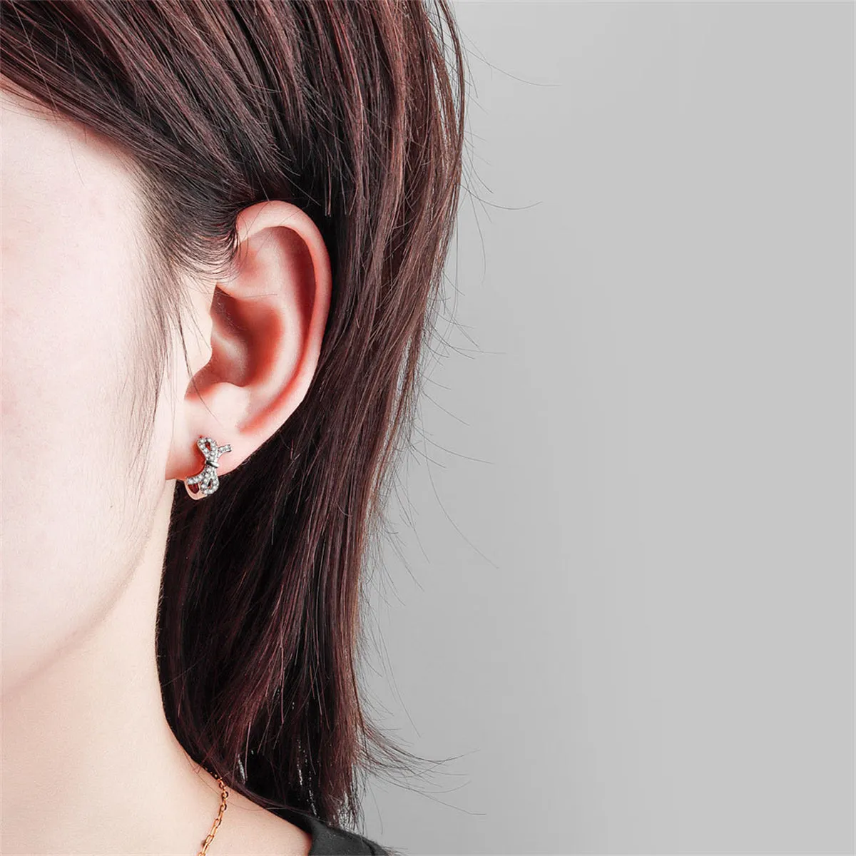 Clear Cubic Zirconia & Silver-Plated Bow Huggie Earrings
