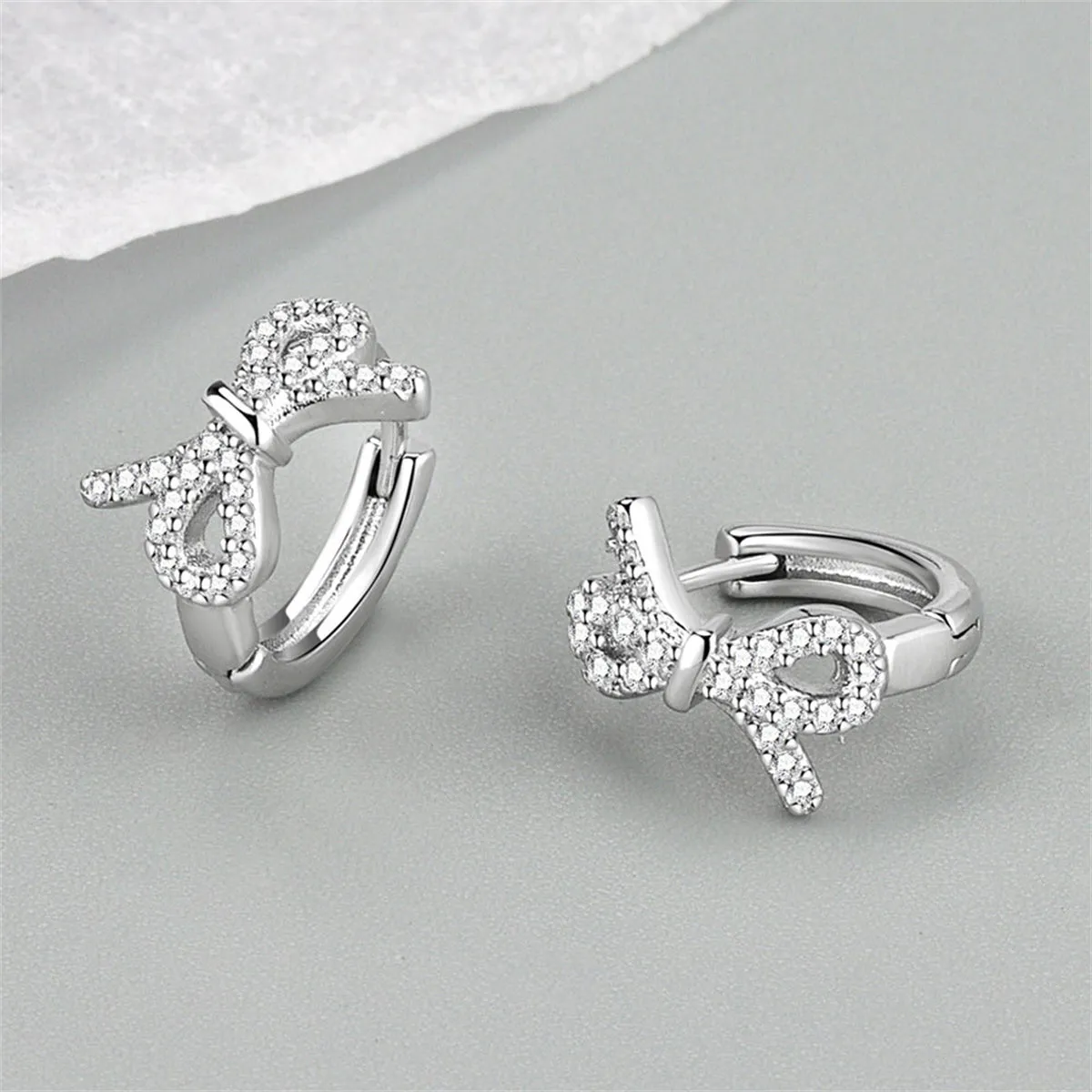 Clear Cubic Zirconia & Silver-Plated Bow Huggie Earrings