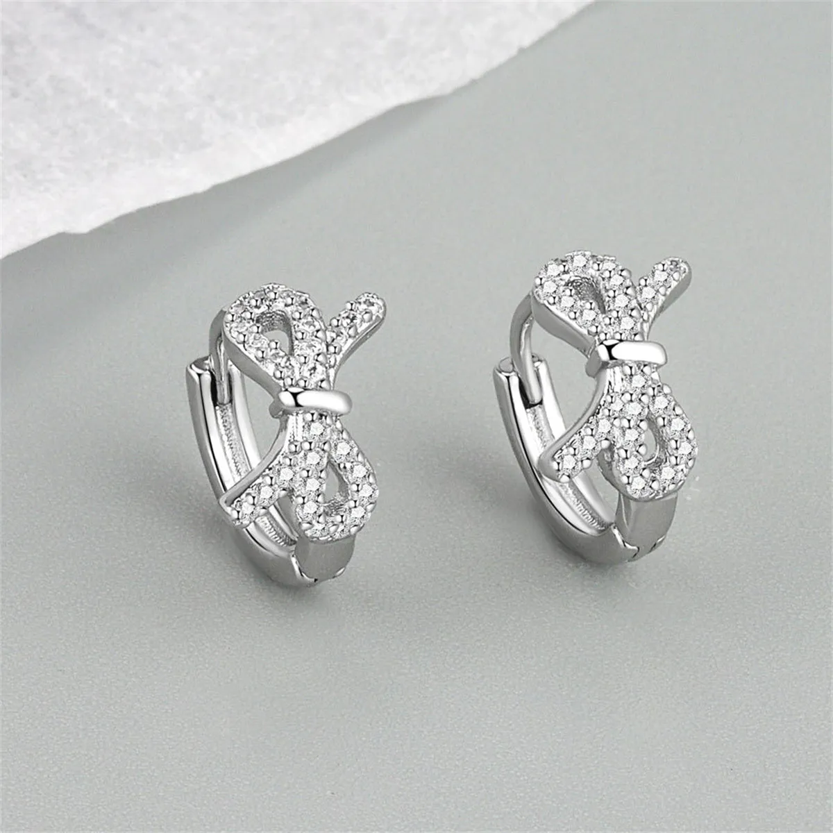 Clear Cubic Zirconia & Silver-Plated Bow Huggie Earrings