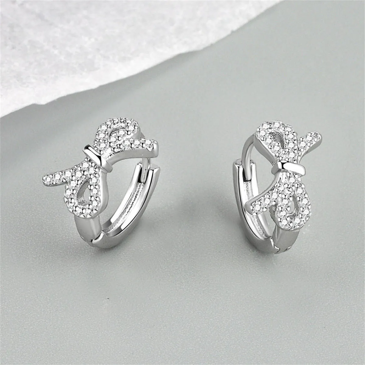 Clear Cubic Zirconia & Silver-Plated Bow Huggie Earrings